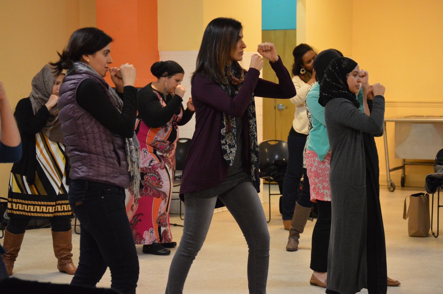 Muslim women get ready to practice their punches. (WTOP/Omama Altaleb)