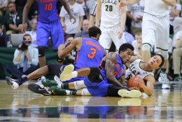 EAST LANSING, MI - DECEMBER 12: Kasey Hill #0 of the Florida Gators and Bryn Forbes #5 of the Michigan State Spartans battle for a loose ball during the game in the second period at the Breslin Center on December 12, 2015 in East Lansing, Michigan. (Photo by Rey Del Rio/Getty Images)