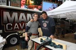 NEW YORK, NY - APRIL 12:  NFL Super Bowl Champion Tony "Goose" Siragusa (R) and Jason Cameron pose for a photograph during a break whilst filming a build of an Ultimate Man Cave in Times Square on April 12, 2011 in New York City.  (Photo by Neilson Barnard/Getty Images)
