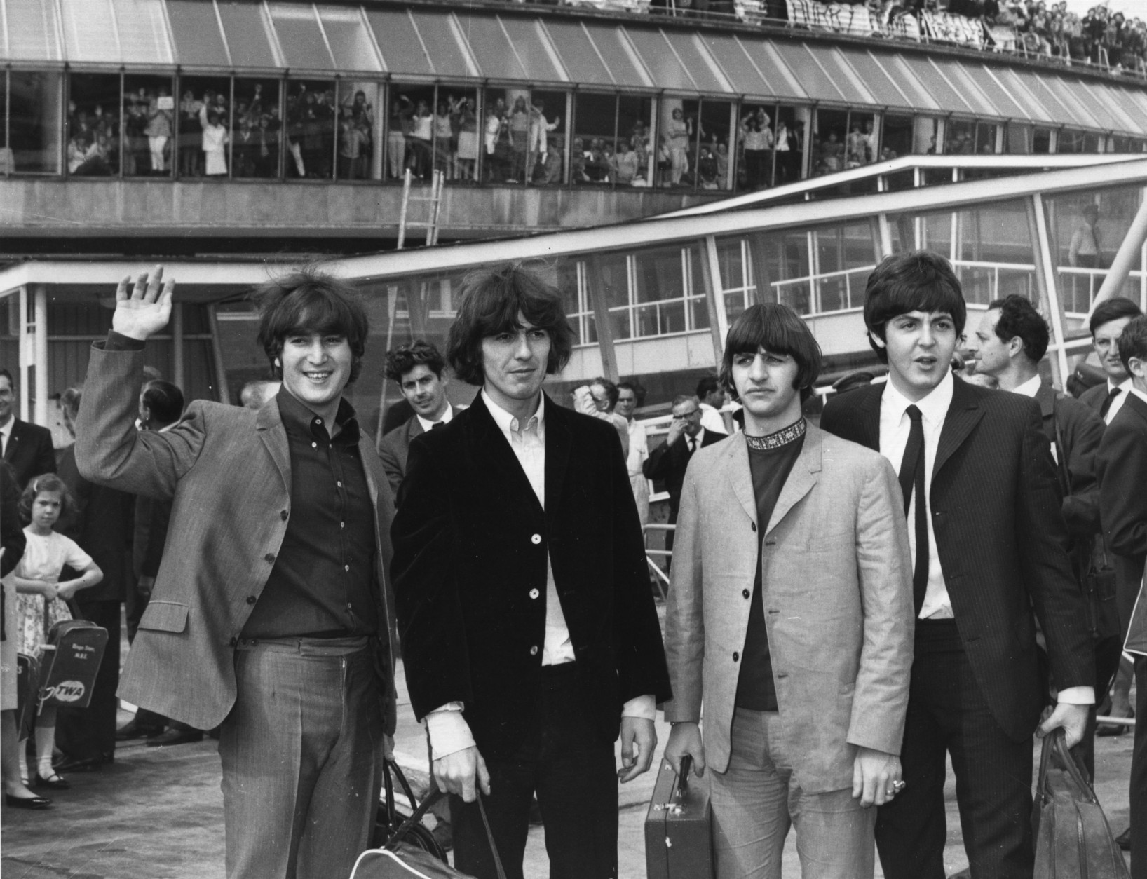 13th August 1965:  Hundreds of teenagers gather at London Airport to give pop group The Beatles a send-off before they board an aeroplane to America.  (Photo by Keystone/Getty Images)