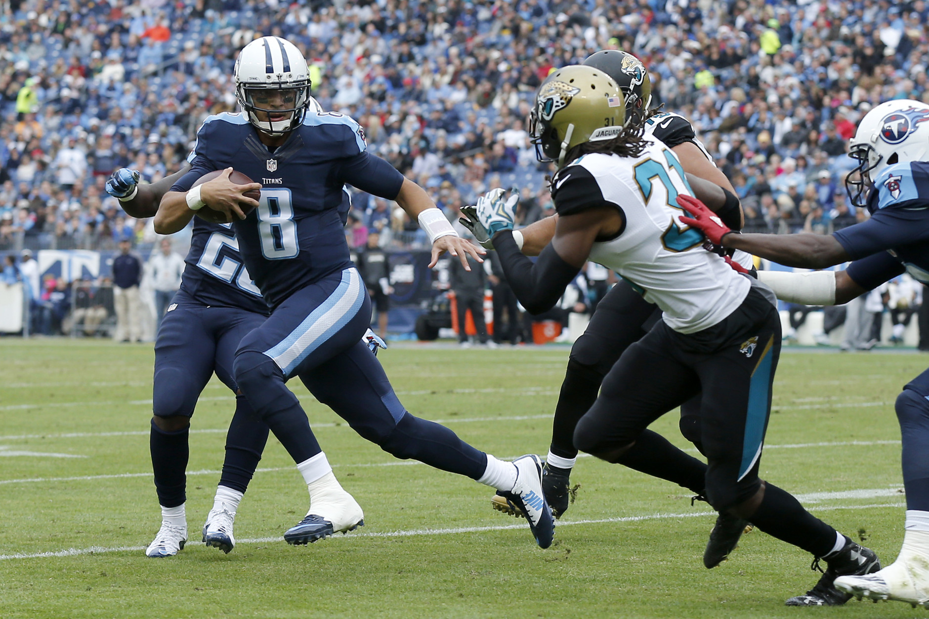 NASHVILLE, TN - DECEMBER 6:  Marcus Mariota #8 of the Tennessee Titans runs with the ball against the Jacksonville Jaguars during the game at Nissan Stadium on December 6, 2015 in Nashville, Tennessee. (Photo by Wesley Hitt/Getty Images)