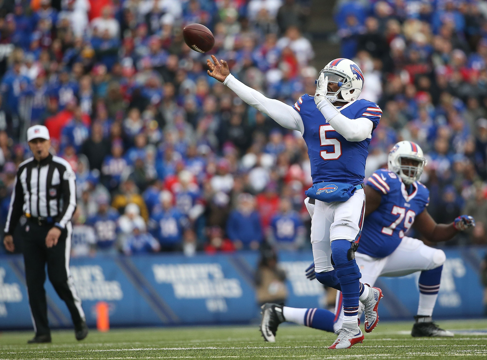 ORCHARD PARK, NY - DECEMBER 06:   Tyrod Taylor #5 of the Buffalo Bills throws the ball against the Houston Texans during the second half at Ralph Wilson Stadium on December 6, 2015 in Orchard Park, New York.  (Photo by Tom Szczerbowski/Getty Images)