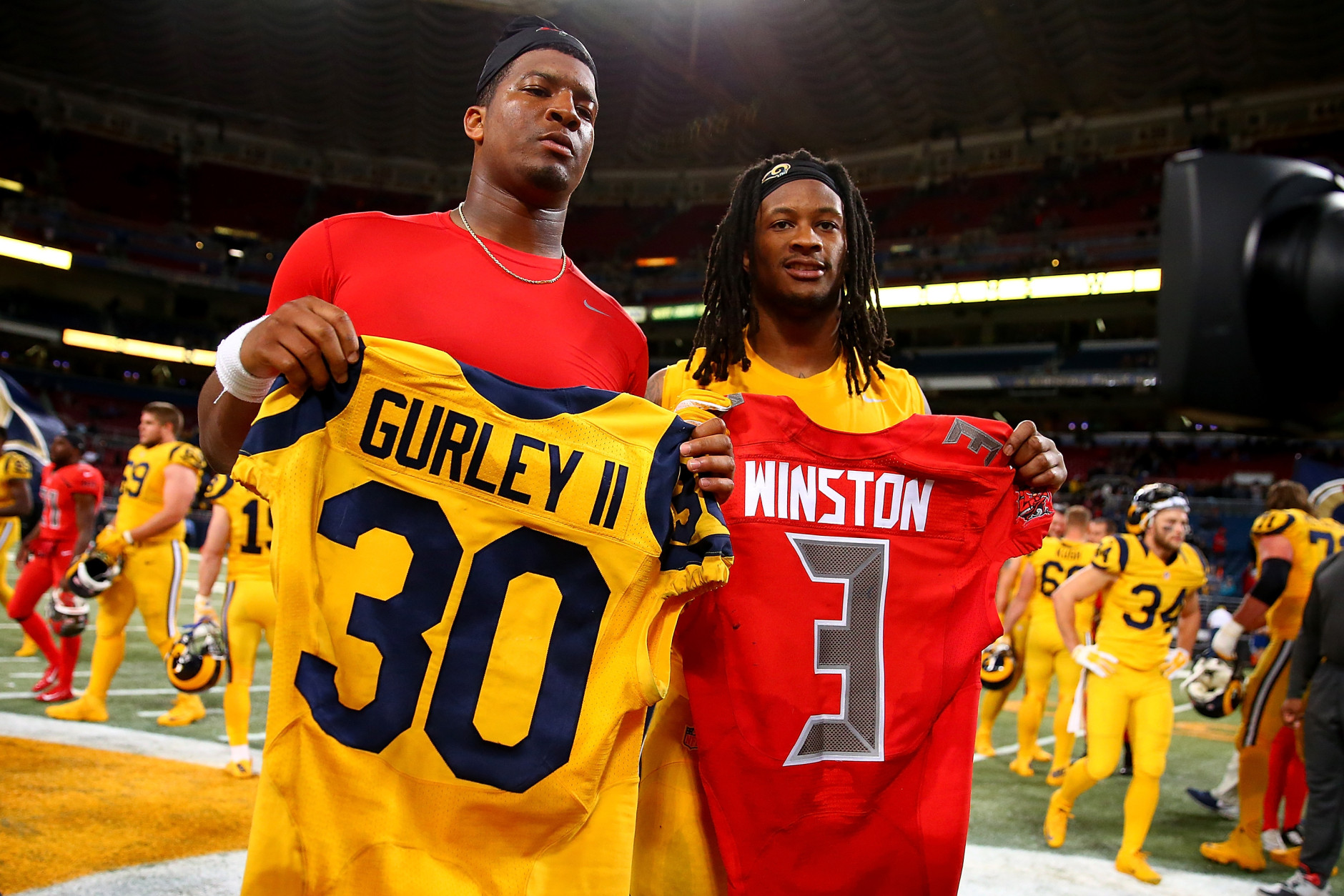 ST. LOUIS, MO - DECEMBER 17: Todd Gurley #30 of the St. Louis Rams and Jameis Winston #3 of the Tampa Bay Buccaneers pose after exchanging jerseys after a game at the Edward Jones Dome on December 17, 2015 in St. Louis, Missouri. (Photo by Dilip Vishwanat/Getty Images)