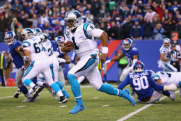 EAST RUTHERFORD, NJ - DECEMBER 20:  Cam Newton #1 of the Carolina Panthers runs against the New York Giants in the fourth Quarter during their game at MetLife Stadium on December 20, 2015 in East Rutherford, New Jersey.  (Photo by Al Bello/Getty Images)