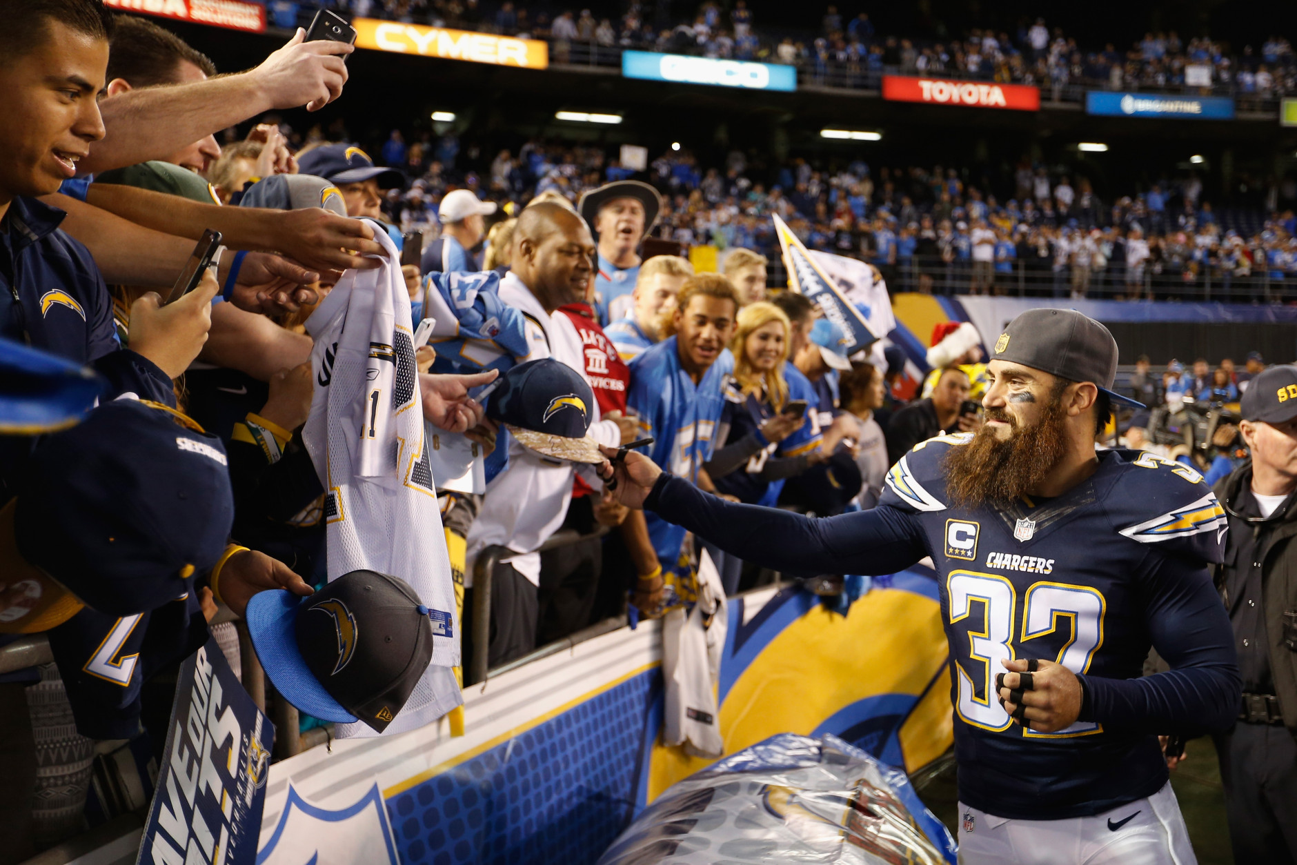SAN DIEGO, CA - DECEMBER 20:   Eric Weddle #32 of the San Diego Chargers greets fans after the San Diego Chargers defeated the Miami Dolphins 30-14 at Qualcomm Stadium on December 20, 2015 in San Diego, California.  (Photo by Sean M. Haffey/Getty Images)
