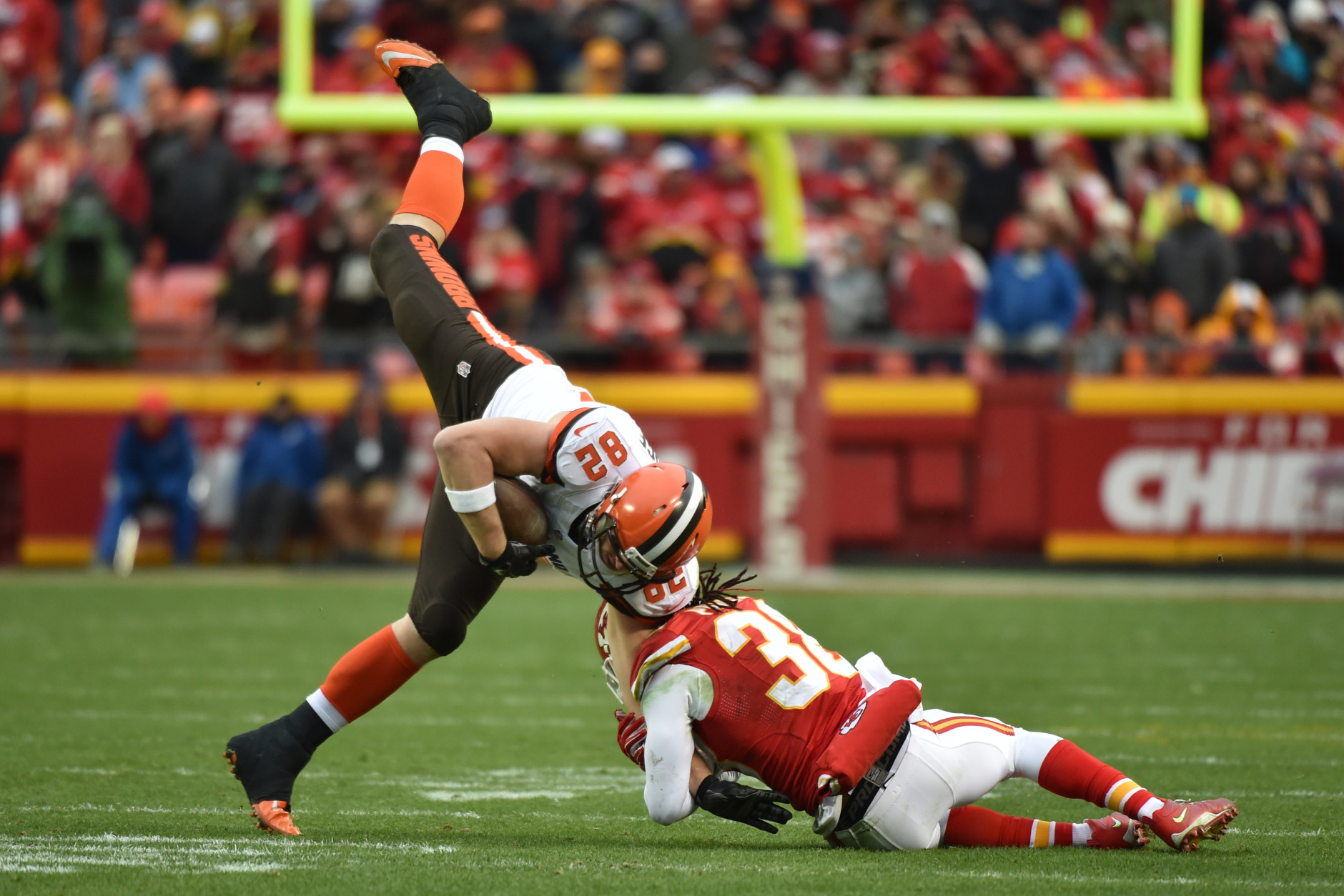 KANSAS CITY, MO - DECEMBER 27: Gary Barnidge #82 of the Cleveland Browns is tackled by Ron Parker #38 of the Kansas City Chiefs  at Arrowhead Stadium during the fourth quarter of the game on December 27, 2015 in Kansas City, Missouri. (Photo by Peter Aiken/Getty Images)