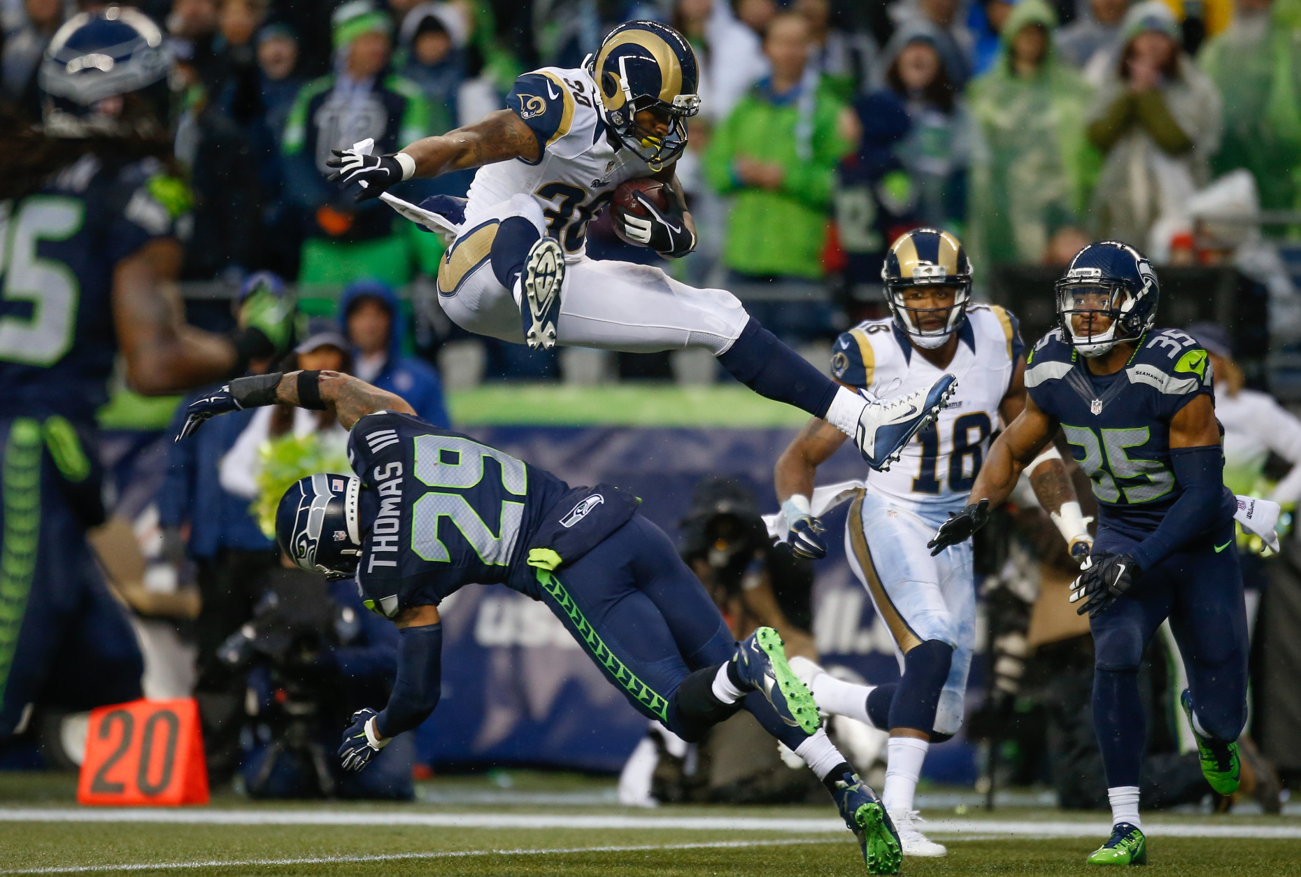 SEATTLE, WA - DECEMBER 27:  Running back Todd Gurley #30 of the St. Louis Rams rushes against free safety Earl Thomas #29 of the Seattle Seahawks at CenturyLink Field on December 27, 2015 in Seattle, Washington. The Rams defeated the Seahawks 23-17. (Photo by Otto Greule Jr/Getty Images)