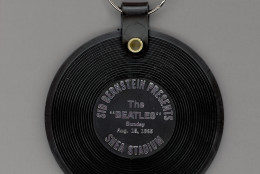 Souvenir keychain that reads 'Sid Bernstein presents The Beatles, Shea Stadium, August 15, 1965'.  With more than 55,000 fans in attendence, this pop concert marked a world record and was a record-grossing milestone for The Beatles.  (Photo by Blank Archives/Getty Images)