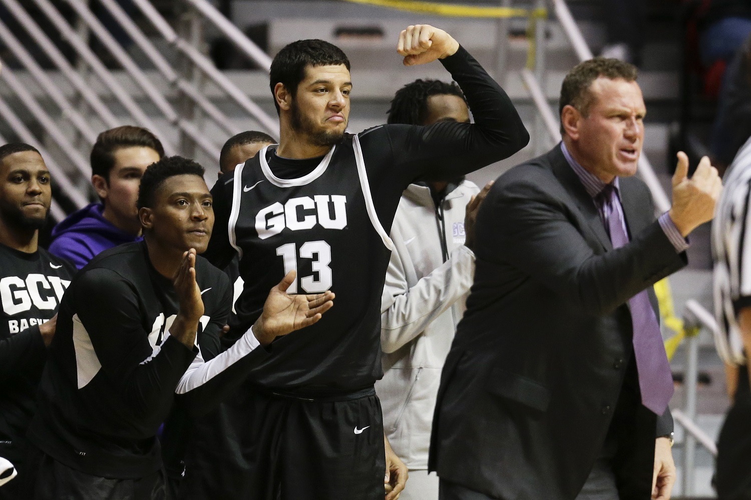 Grand Canyon State forward Uros Ljeskovic (13) and others on the bench react during the second half of an NCAA college basketball game against San Diego State on Friday, Dec. 18, 2015, in San Diego. Coach Dan Majerle motions is at right. (AP Photo/Gregory Bull)
