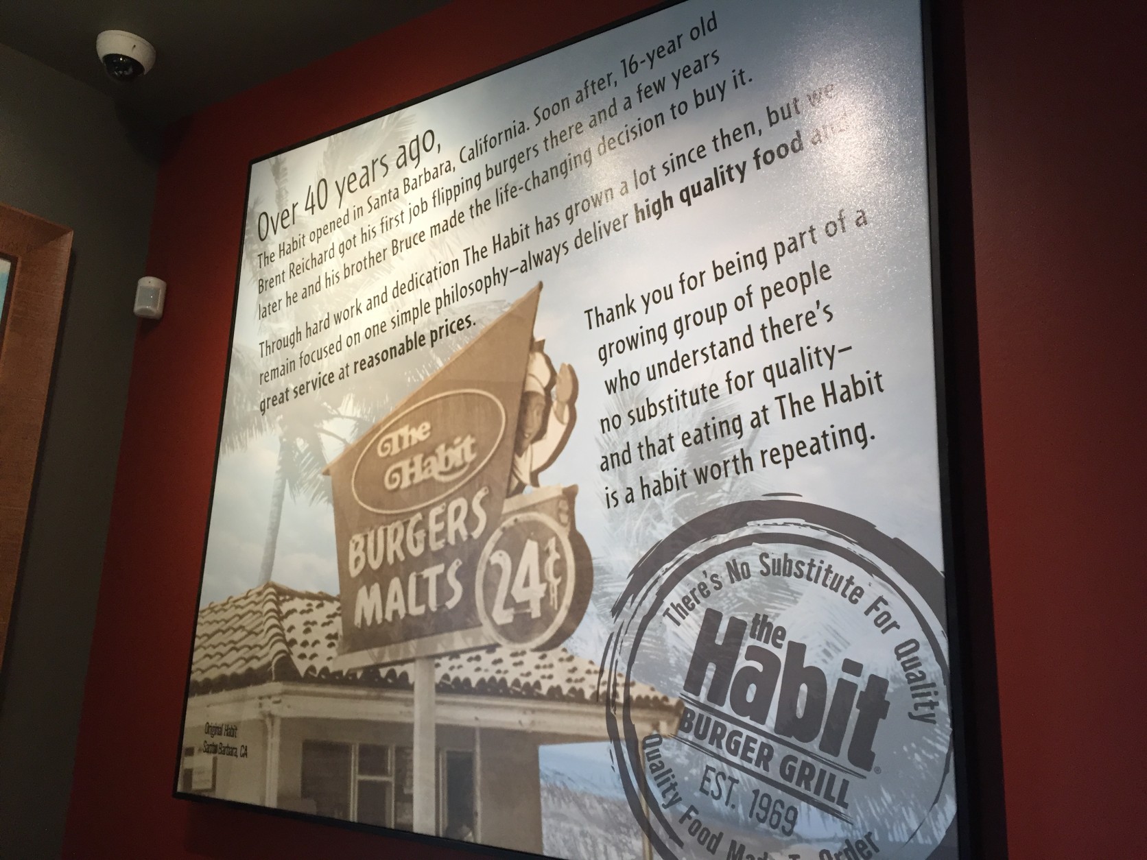 A sign inside The Habit Burger Grill tells the restaurant's origin story. (WTOP/Michelle Basch)