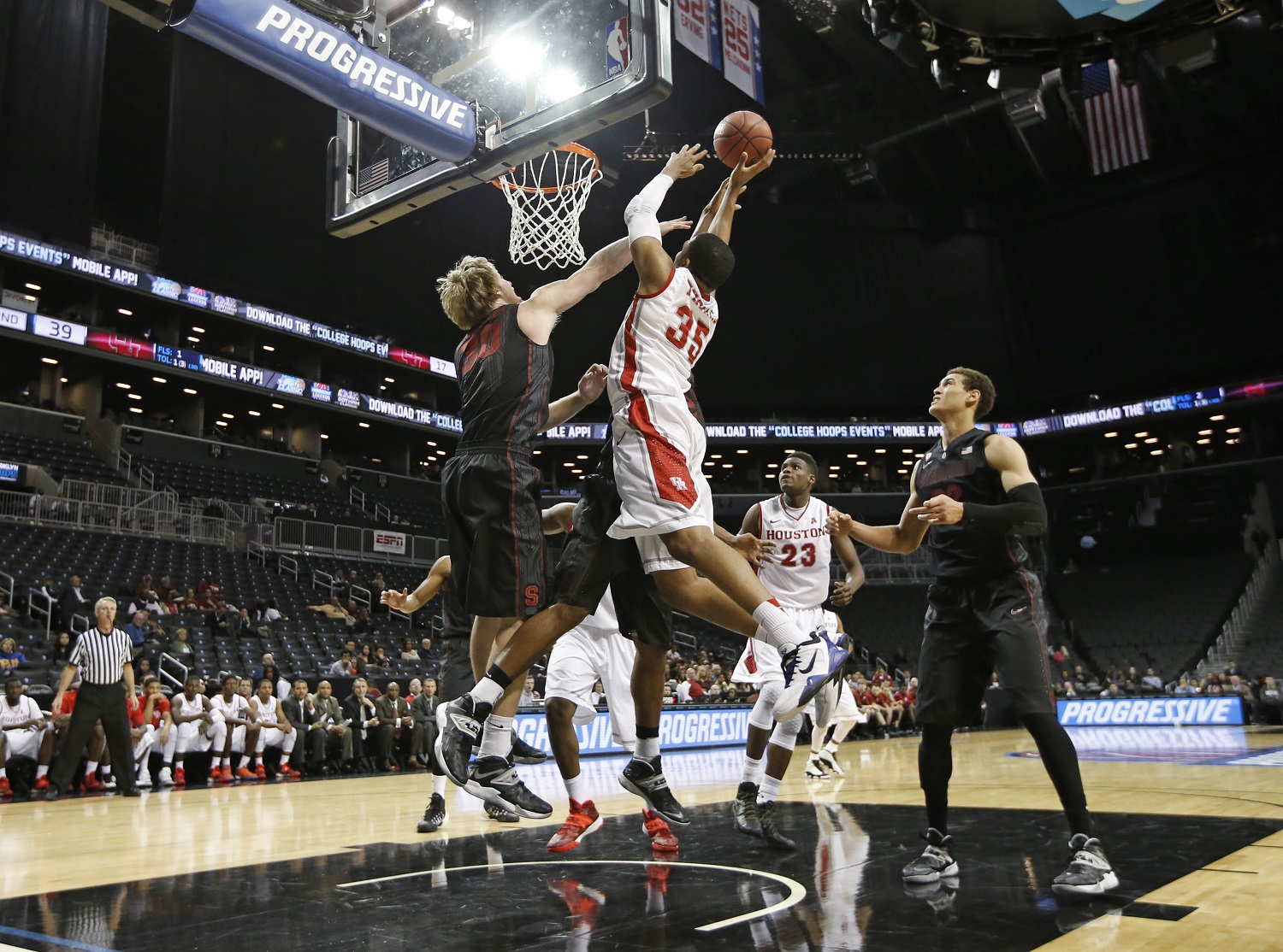 Stanford center Grant Verhoeven (30) defends as Houston Cougars forward TaShawn Thomas (35) shoots in the second half of their NCAA college basketball game, part of the Legends Classic, Tuesday, Nov. 26, 2013, in New York. Stanford defeated Houston 86-76. (AP Photo/Kathy Willens)