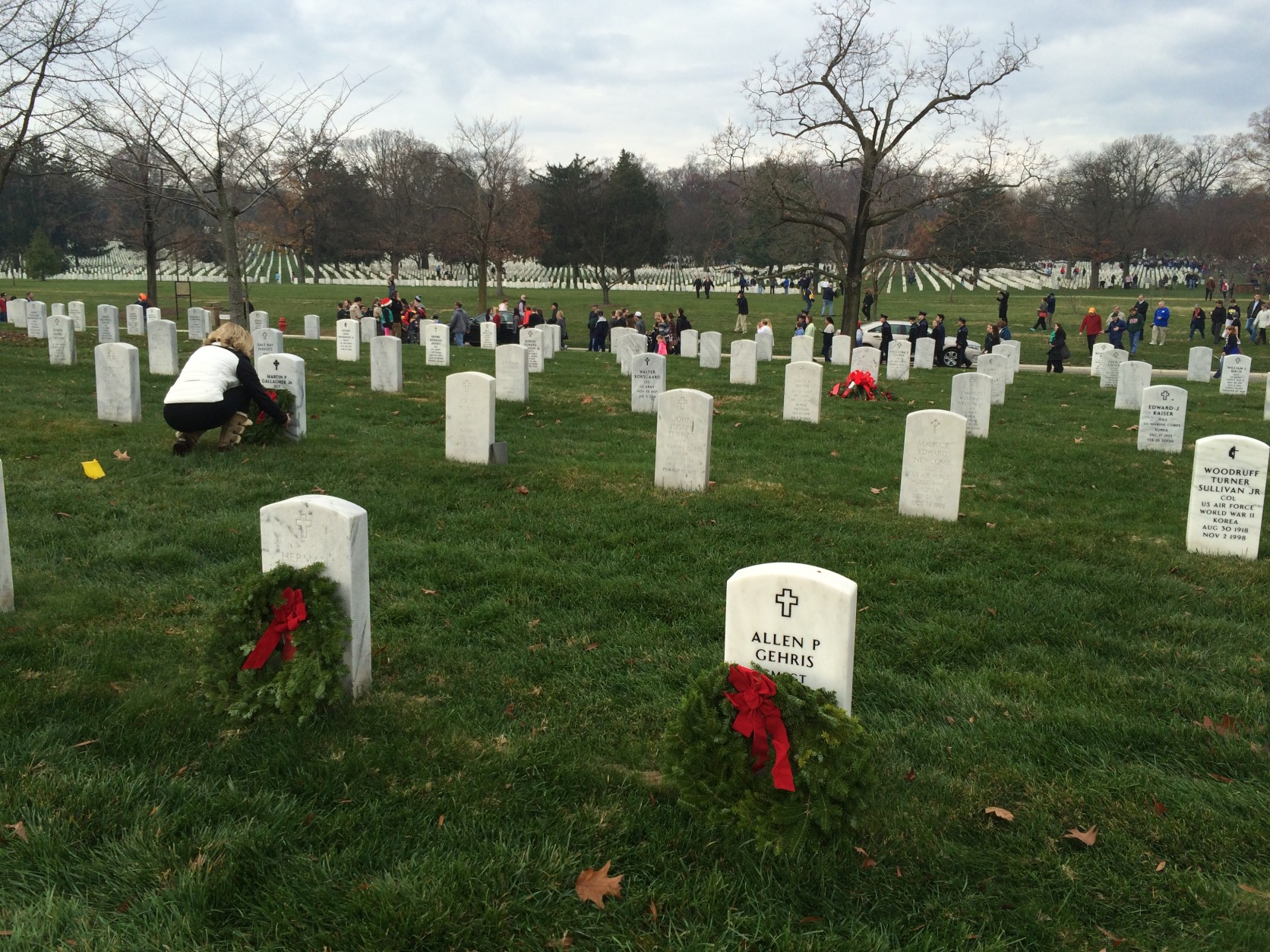 Thousands of families, friends and strangers placed wreaths on the graves of veterans and fallen soldiers at Arlington National Cemetery on Saturday, Dec. 12, 2105. (WTOP/Nick Iannelli)