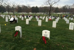 Thousands of families, friends and strangers placed wreaths on the graves of veterans and fallen soldiers at Arlington National Cemetery on Saturday, Dec. 12, 2105. (WTOP/Nick Iannelli)