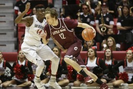 Arkansas-Little Rock forward Lis Shoshi, right, drives around San Diego State forward Zylan Cheatham to score in the second half of an NCAA college basketball game Saturday, Nov. 21, 2015, in San Diego. (AP Photo/Lenny Ignelzi)