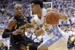 North Carolina's Marcus Paige (5) dribbles as Maryland's Rasheed Sulaimon (0) defends during the first half of an NCAA college basketball game in Chapel Hill, N.C., Tuesday, Dec. 1, 2015. (AP Photo/Gerry Broome)