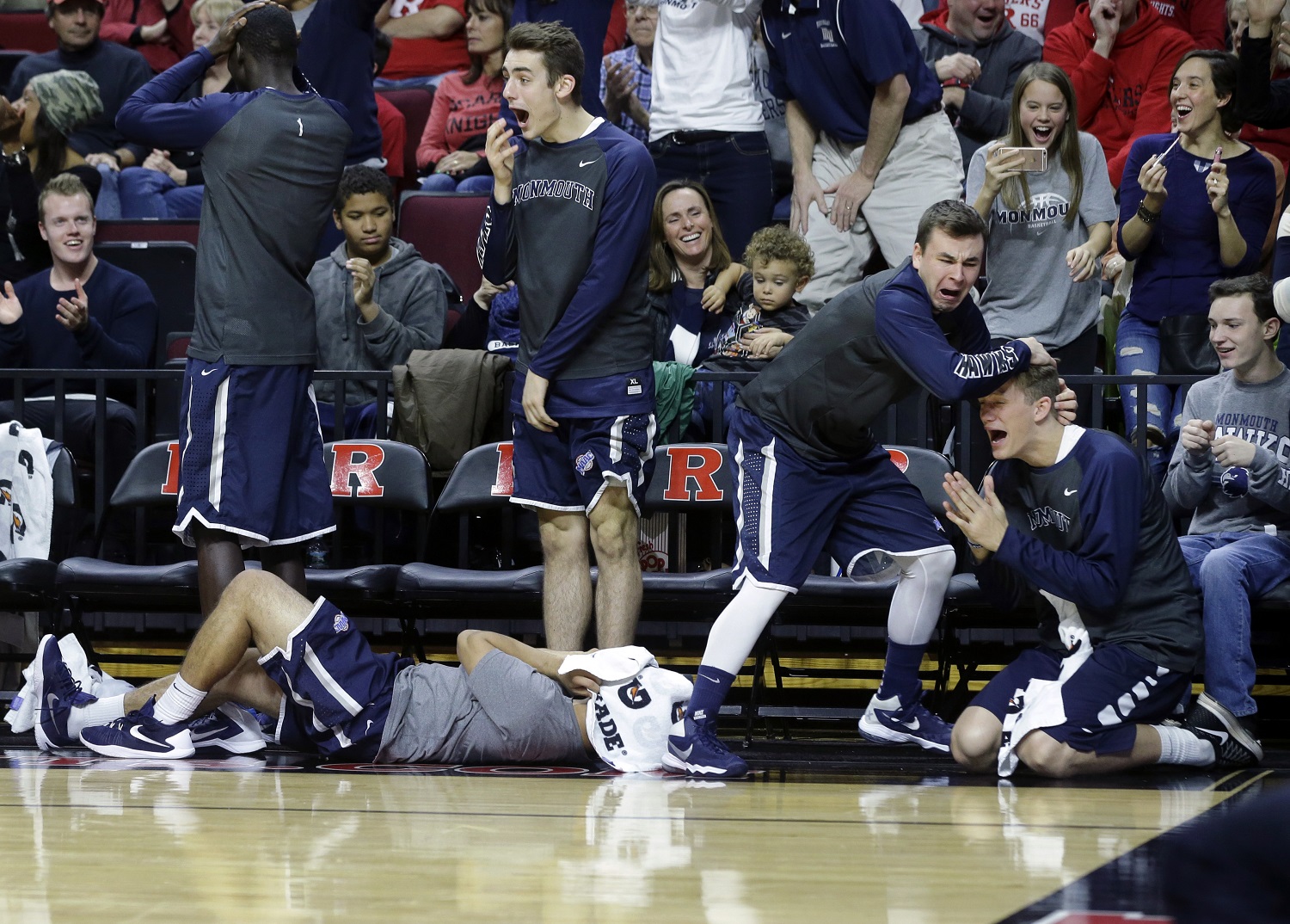 Monmouth players react on the bench to a play during the first half of an NCAA college basketball game against Rutgers, Sunday, Dec. 20, 2015, in Piscataway, N.J.  (AP Photo/Mel Evans)