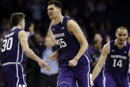 Northwestern forward Aaron Falzon (35) reacts after making a three point basket during overtime of an NCAA college basketball game against DePaul on Saturday, Dec. 19, 2015, in Rosemont, Ill. Northwestern won 78-70. (AP Photo/Nam Y. Huh)