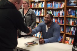 Former Baltimore Ravens linebacker and MVP recipient Ray Lewis met with fans and signed copies of his new book in D.C. Tuesday. (WTOP/Molly Welton)