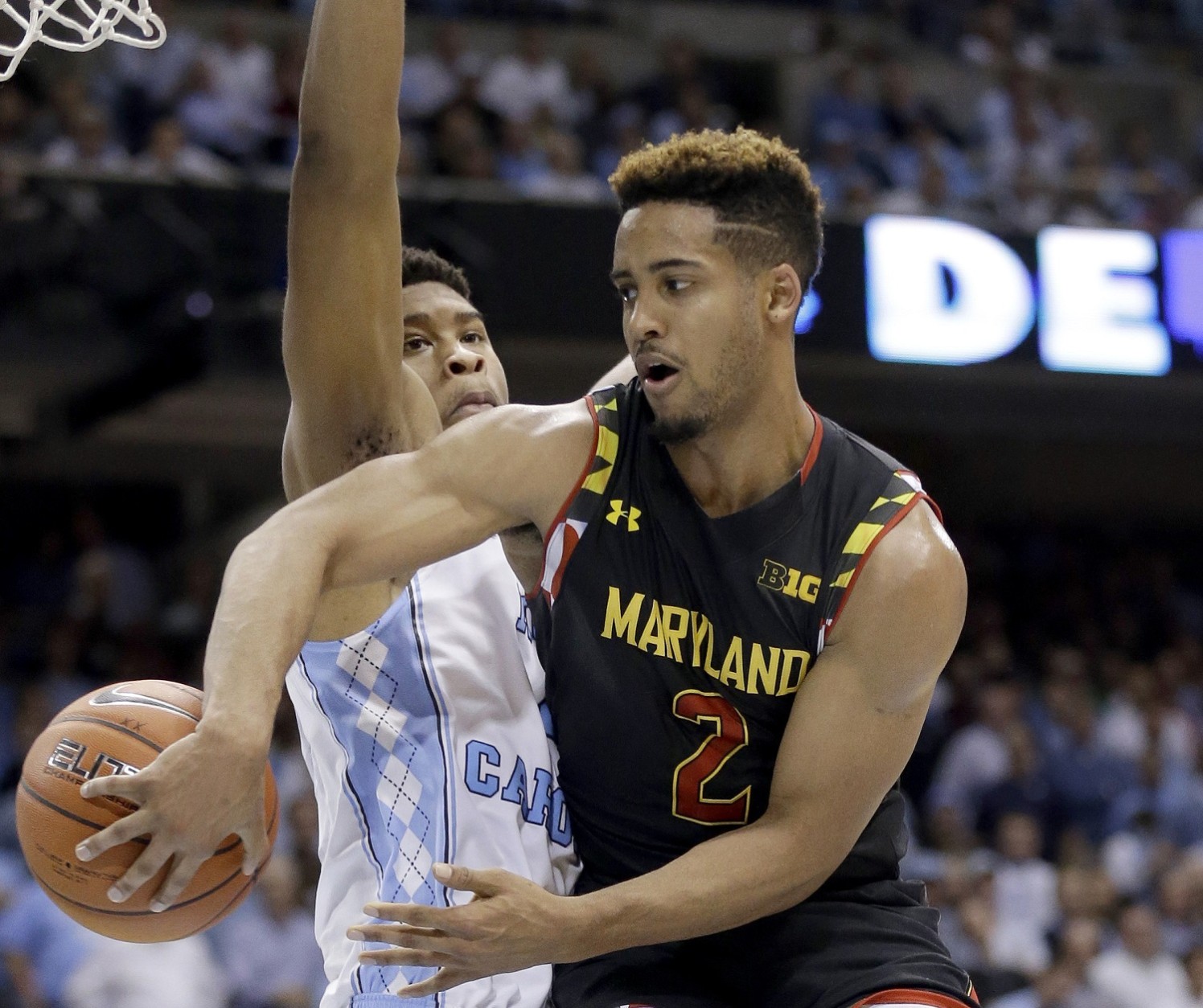 North Carolina's Isaiah Hicks defends against Maryland's Melo Trimble (2) during the second half of an NCAA college basketball game in Chapel Hill, N.C., Tuesday, Dec. 1, 2015. North Carolina won 89-81. (AP Photo/Gerry Broome)