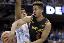North Carolina's Isaiah Hicks defends against Maryland's Melo Trimble (2) during the second half of an NCAA college basketball game in Chapel Hill, N.C., Tuesday, Dec. 1, 2015. North Carolina won 89-81. (AP Photo/Gerry Broome)