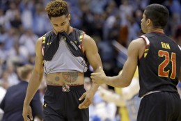 Maryland's Melo Trimble, left, reacts with Varun Ram (21) following the team's 89-81 loss to North Carolina in an NCAA college basketball game in Chapel Hill, N.C., Tuesday, Dec. 1, 2015. (AP Photo/Gerry Broome)