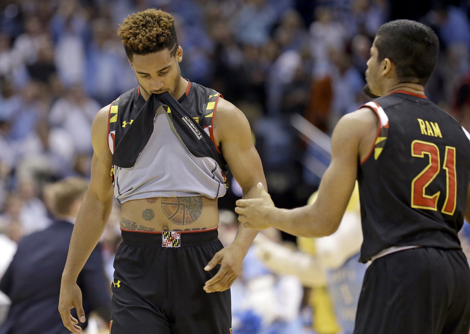 Maryland's Melo Trimble, left, reacts with Varun Ram (21) following the team's 89-81 loss to North Carolina in an NCAA college basketball game in Chapel Hill, N.C., Tuesday, Dec. 1, 2015. (AP Photo/Gerry Broome)