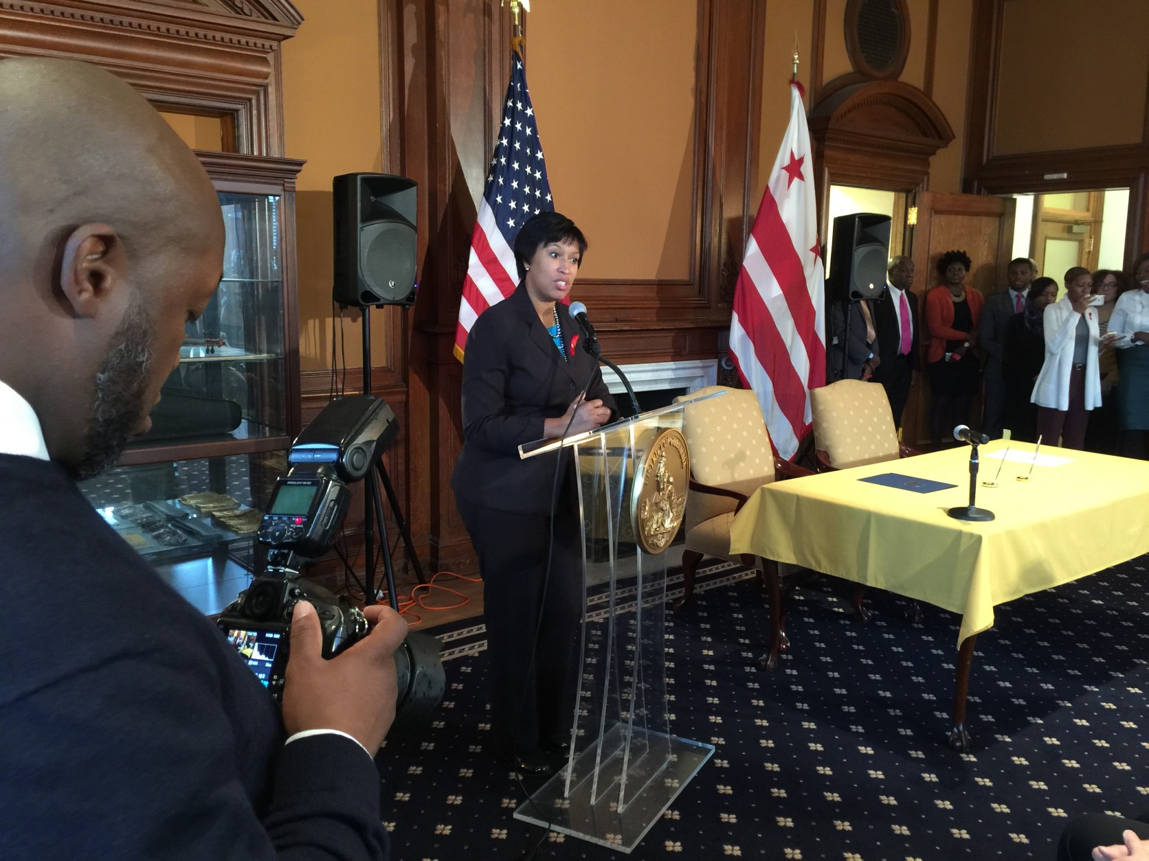 "In 2013, there were no babies born with HIV [in D.C.] and that's a good thing," Mayor Muriel Bowser said at Tuesday’s signing ceremony. The proclamation Bowser signed says the city has a goal of decreasing new HIV cases by 50 percent by 2020. (WTOP/Kristi King)