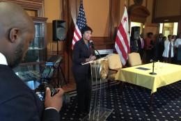 "In 2013, there were no babies born with HIV [in D.C.] and that's a good thing," Mayor Muriel Bowser said at Tuesday’s signing ceremony. The proclamation Bowser signed says the city has a goal of decreasing new HIV cases by 50 percent by 2020. (WTOP/Kristi King)