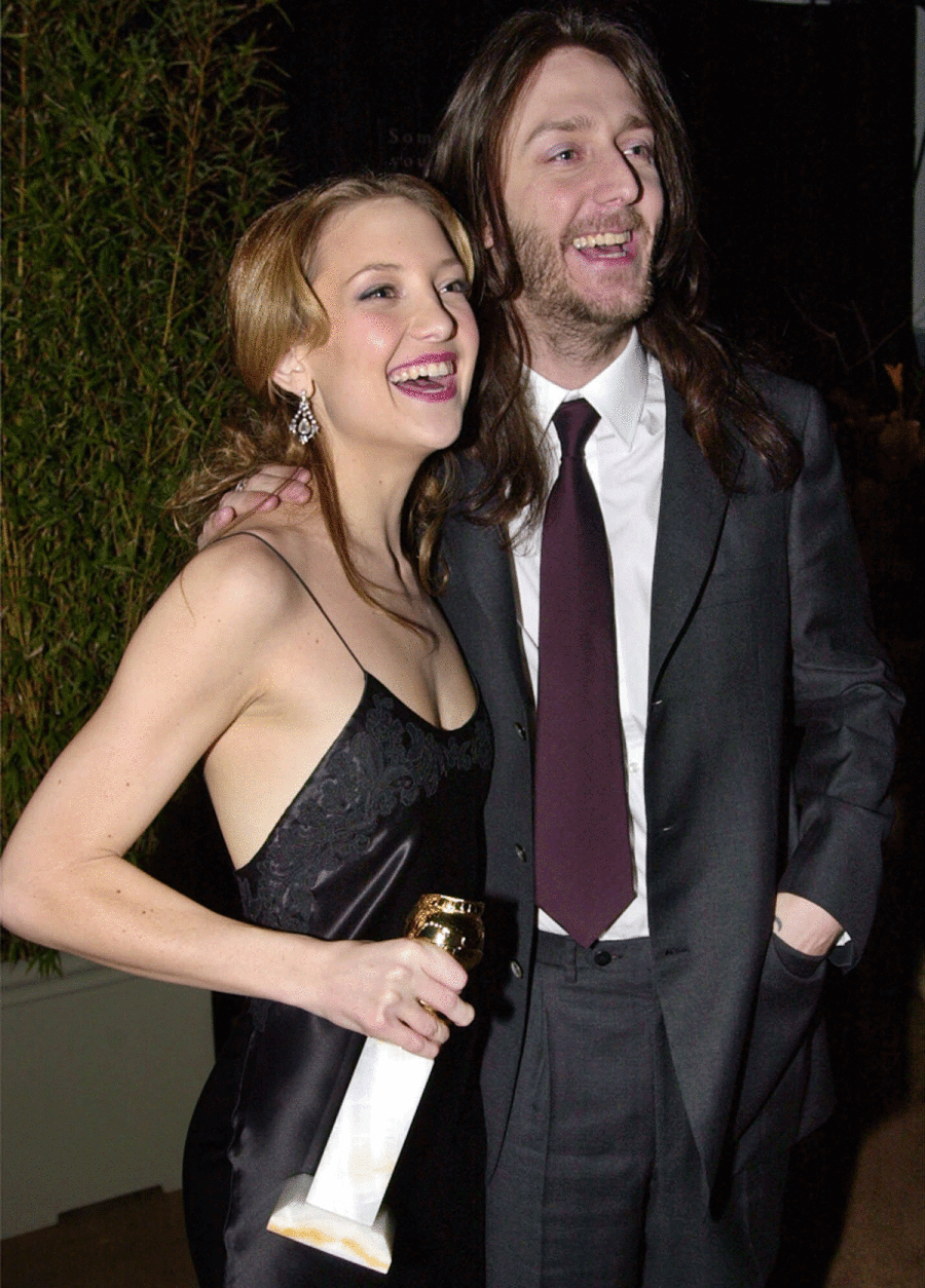 Award-winner Kate Hudson, left, celebrates with husband Chris Robinson of the rock group Black Crows at the Dreamworks Studios party following the 58th Annual Golden Globe Awards in Beverly Hills, Calif., Sunday, Jan. 21, 2001. Hudson won best supporting actress in a comedy for her role in the film "Almost Famous." (AP Photo/Kevork Djansezian)