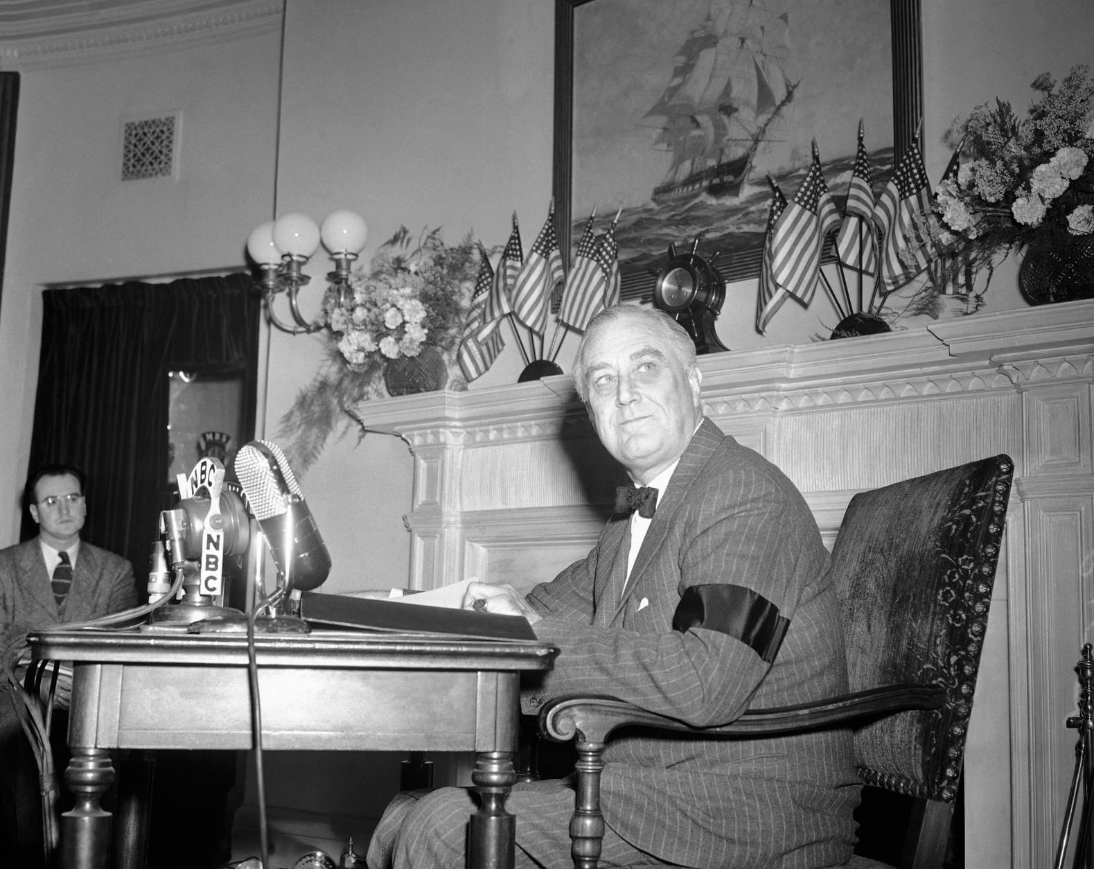 Presiden Franklin Roosevelt  speaking from in front of a fireplace in the oval room of the White House in Washington on Dec. 9, 1941 broadcast to the nation a declaration that ?we are now in this war, we are all in it ? all the way.? (AP Photo)