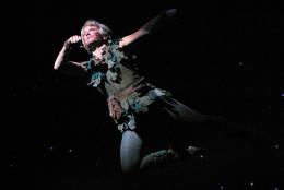 Former Olympic gymnast and Broadway star Cathy Rigby, who is launching a nationwide, yearlong tour, performs as "Peter Pan" at La Mirada Theater for the Performing Arts in La Mirada, Calif. Sept. 24, 2004. Rigby,  51, says this will be the last time she plays the role.  (AP Photo/Stefano Paltera)