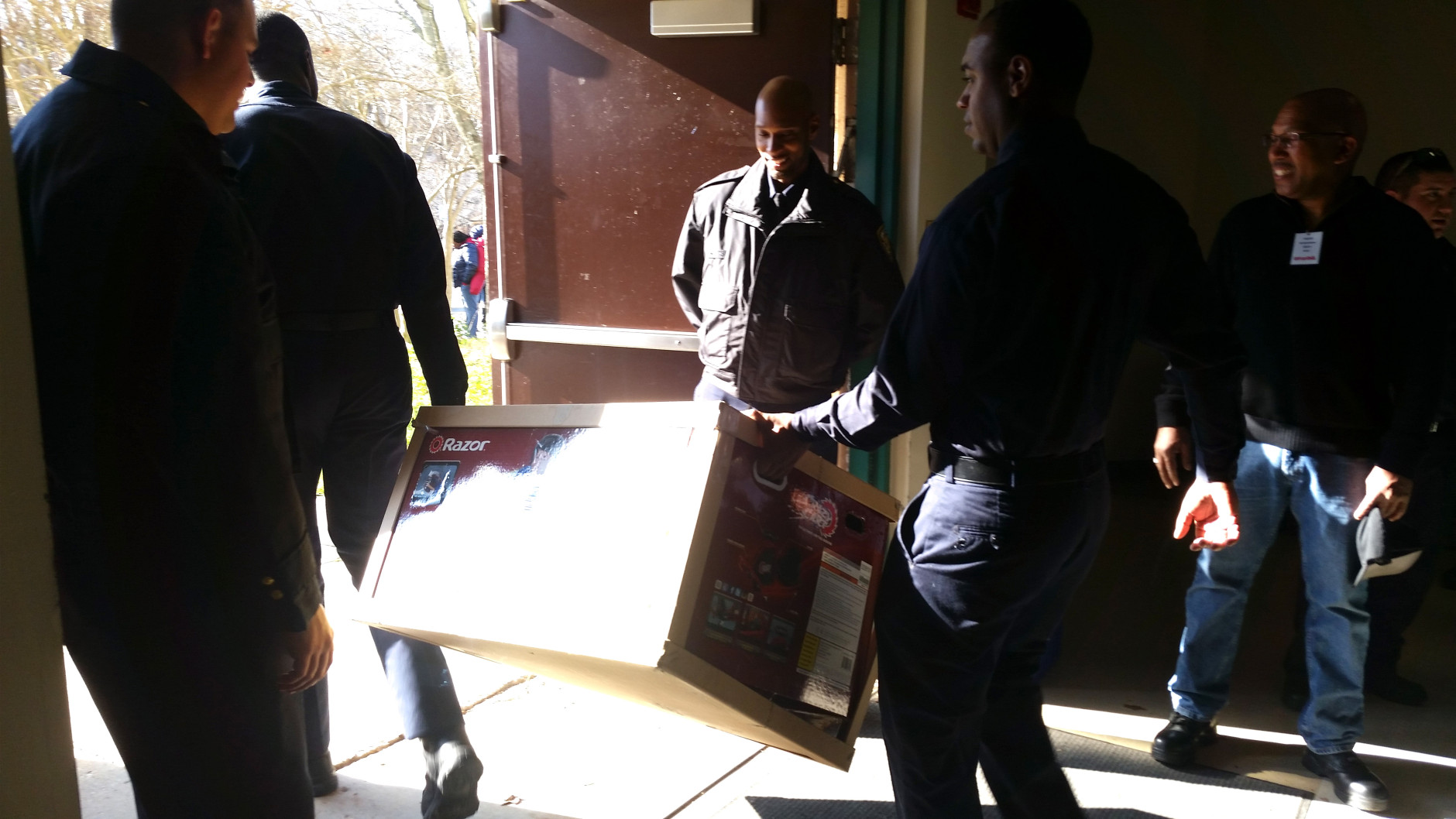 Volunteers distributed more than 50,000 toys during a Toys for Tots event at Prince George’s County police headquarters on Saturday, Dec. 19, 2015. (WTOP/Allison Keyes)