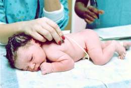 **FILE** Newborn Elizabeth Jordan Carr, the first "test tube" baby born in the United States in Norfolk, Va., is seen in a Dec. 21, 1981 file photo. Carr, now 21 and a senior at Simmons College in Boston, met her birth doctor Fredrick Wirth in a reunion Tuesday, Sept. 23, 2003, in Boston. (AP Photo/File)
