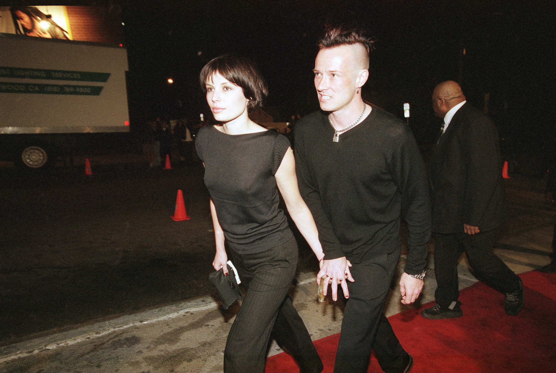 Scott Weiland, vocalist of the re-formed Stone Temple Pilots rock band, arrives with his girlfriend, Mary Frosberg, at the grand re-opening of the Viper Room club in West Hollywood, California, Saturday, Jan. 9, 1998. The event featured a performance by the rock band Hole. (AP Photo/Chris Pizzello)