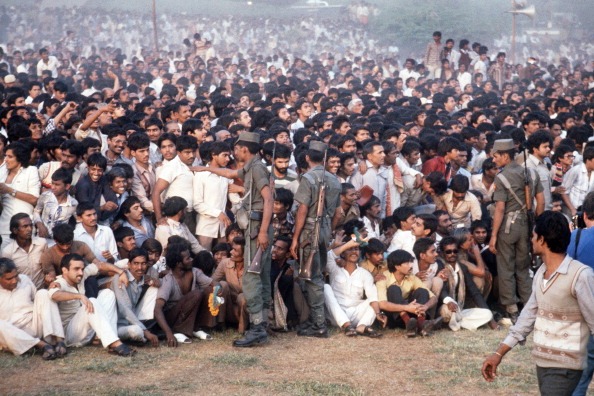 A large crowd attends the cremation ceremony of the slain Indian Prime Minister Indira Gandhi, on November 03, 1984 in Shanti-Van. Indian Prime Minister Indira Gandhi was shot dead by two of her Sikh bodyguards 31 October 1984. (Photo credit should read /AFP/Getty Images)