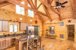 At Boulder Crest, log cabins equipped with stone fireplaces, gourmet kitchens and “the best beds money can buy” sit atop a small hill overlooking lush green fields, horse stables, hiking trails and a walled-in therapeutic garden. (Courtesy Boulder Crest Retreat) 