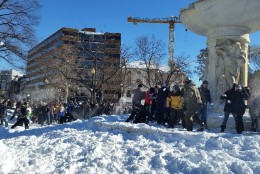 About 200 hundred people gathered at Dupont Circle on Sunday morning for Snow Wars: The Snowball Strikes Back. (WTOP/Kathy Stewart)