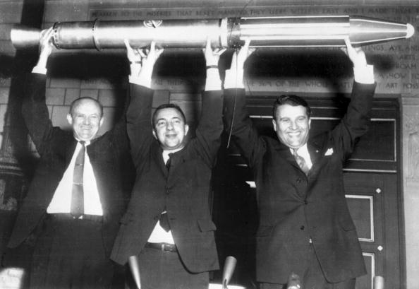 William Picketing, James Van Allen, and German scientist Wernher von Braun (from L to R) brandish a model of the first American satellite "Explorer 1", 31 January 1958 after the satellite was launched of by a "Jupiter C" rocket at Cap Canaveral Space Center. Wernher von Braun's team developed the Jupiter-C, a modified Redstone rocket, which successfully launched Explorer 1. This event signaled the birth of America's space program. Von Braun, who was pivotal in Germany's pre-war rocket development program and was responsible for the design and realization of the V-2 combat rocket during World War II, entered the United States at the end of the war through the then-secret Operation Paperclip. (Photo credit should read OFF/AFP/Getty Images)