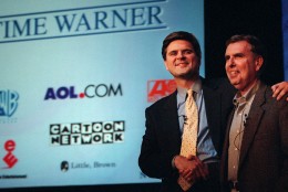 America Online's chairman and chief executive, Steve Case, left, and Time Warner's chairman and chief executive, Gerald Levin, shake hands before a news conference Monday, Jan. 10, 2000, in New York. Time Warner, the world's largest media and entertainment company, is being acquired by America Online for about $166 billion in stock in what would be the biggest corporate merger ever. (AP Photo/Stuart Ramson)