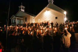 ** RETRANSMISSION FOR ALTERNATE TONING ** A candlelight memorial service for the 12 miners who died in a mine explosion at the Sago Mine in Tallmansville, W.Va., is held at the Sago Baptist Church Wednesday evening Jan. 4, 2006.(AP Photo/Gene J. Puskar)