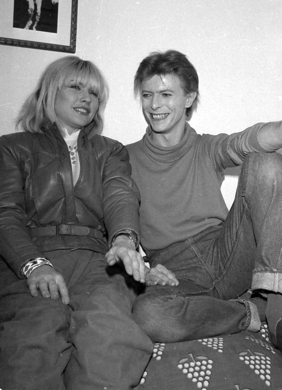 Deborah Harry of the rock band Blondie visits David Bowie backstage at the Booth Theater where he is starring in "The Elephant Man," Nov. 1980.  (AP Photo/Nancy Kaye)