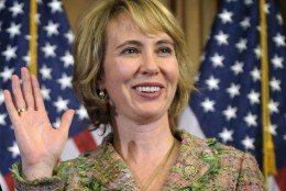 FILE - In this Jan. 5, 2011 file photo, Rep. Gabrielle Giffords, D-Ariz., takes part in a reenactment of her swearing-in, on Capitol Hill in Washington. Time magazine has named Giffords one of the 100 most influential people in the world. (AP Photo/Susan Walsh, File)