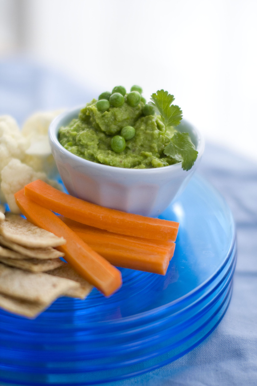 This Feb. 21, 2011 photo shows sweet pea and avocado guacamole in Concord, N.H. This guacamole is a spring-inspired version of the classic dip, and has a fresh, crisp flavor that is brightened by plenty of fire-roasted chilies, lime juice and chopped fresh cilantro. Use this dip as you would a traditional guacamole. Or for a refreshing variation, serve with a plate of sliced bell peppers and carrot sticks.     (AP Photo/Matthew Mead)