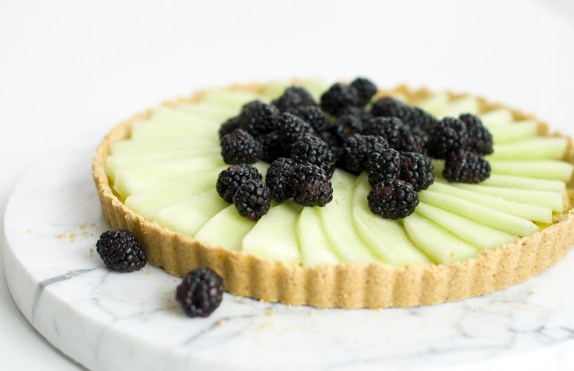 This March 15, 2011 photo shows a honeydew-blackberry tart in Concord, N.H. This tart offers a nice balance between light and luxurious.   (AP Photo/Matthew Mead)