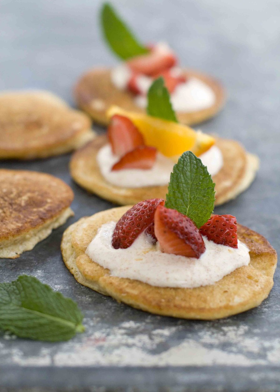 This April 11, 2011 photo shows griddled corncakes with cinnamon-honey yogurt in Concord, N.H.  These corncakes are moist, tender, tasty and sport an ingredient list the whole family can feel good about.    (AP Photo/Matthew Mead)