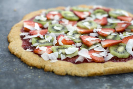 This April 11, 2011 photo shows strawberry-kiwi dessert pizza in Concord, N.H. The beauty of this dessert pizza is that it looks like it should be a diet buster, but it really isnt.      (AP Photo/Matthew Mead)