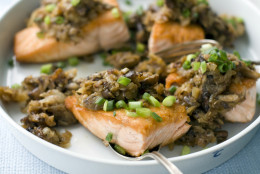 This July 18, 2011 photo shows salmon with shiitake hash in Concord, N.H. The earthy flavor of shiitake mushrooms mixed with shredded potatoes complements the rich fish.  (AP Photo/Matthew Mead)