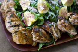 This Aug. 15, 2011 photo shows Rocco DiSpirito's warm salad of grilled chicken thighs, figs and shaved Parmigiano-Reggiano.  Before serving this dish, place the chicken thigh halves around the salad, then sprinkle the salad with the shaved Parmigiano-Reggiano.    (AP Photo/Matthew Mead)