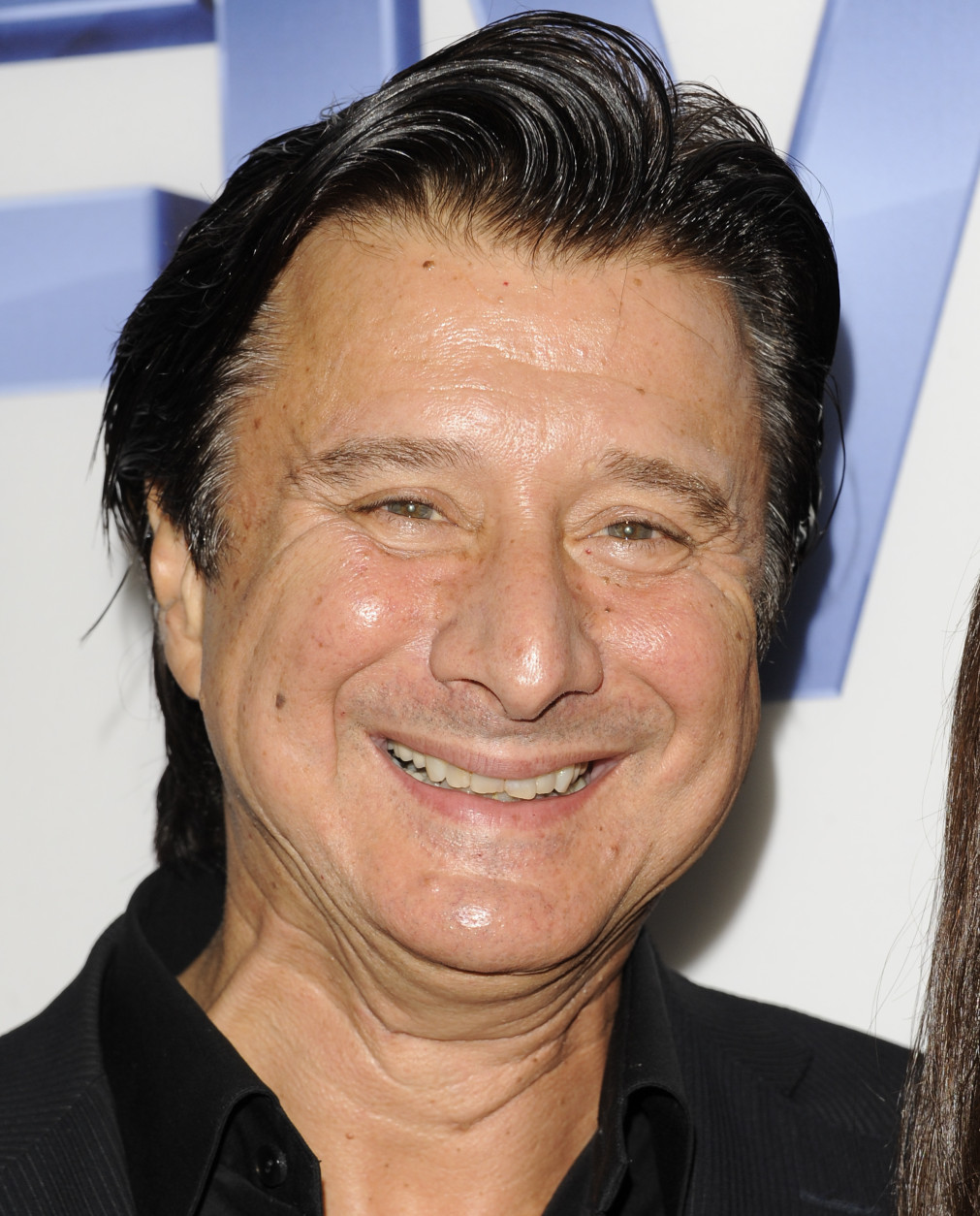 FILE - In this Sept. 26, 2011 file photo, Steve Perry, former lead singer of the rock band Journey, arrives at  a premiere screening at Skylight SoHo in New York. Perry said though the band's songs -- including the soundtrack staple "Don't Stop Believin'" have experienced a resurgence in recent years, there's little chance of Perry rejoining the band and participating in what likely would be a lucrative tour.  (AP Photo/Evan Agostini, file)