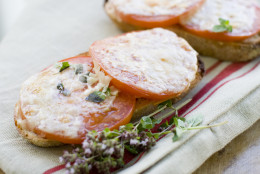This July 15, 2013 photo shows toasted Parmesan tomato bread in Concord, N.H. (AP Photo/Matthew Mead)